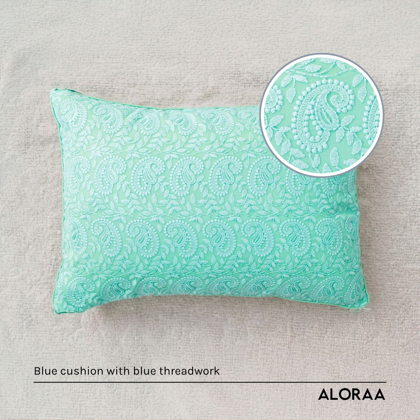 Blue paisley cushion cover with intricate threadwork pattern for decorative home use
