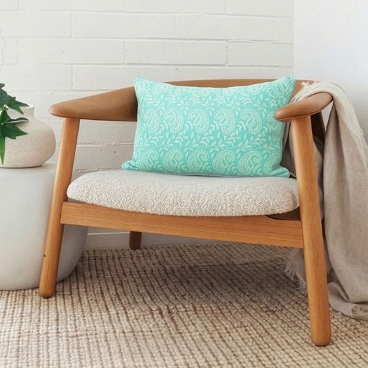 Teal paisley print cushion cover on a wooden armchair - hand embroidered Indian home decor | ALORAA