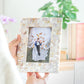 Handmade mother of pearl chevron photo frame held for scale