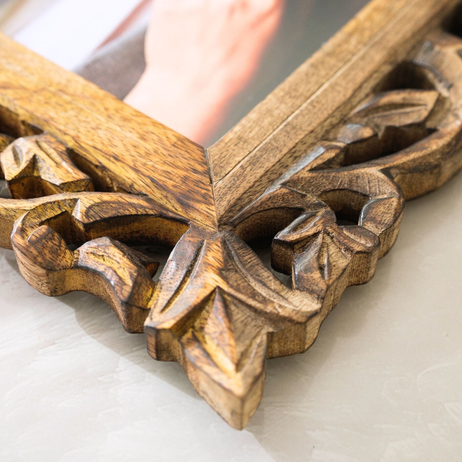 Corner detail of hand carved Jali photo frame showing deep floral relief carving in natural wood | ALORAA