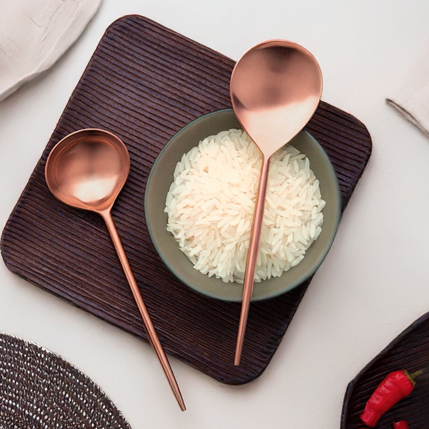 Handmade stainless steel servers set of 2 styled with a rice bowl on a dark wooden serving board | ALORAA