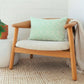 Minty green paisley print cushion cover on a wooden armchair - hand embroidered Indian cushion cover | ALORAA